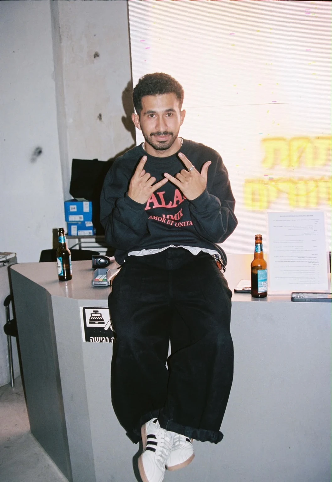 MOZES in a sweatshirt and wide-leg trousers